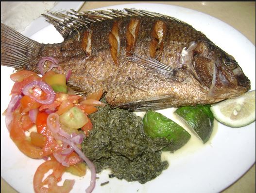 Image result for kenyan eating fish"